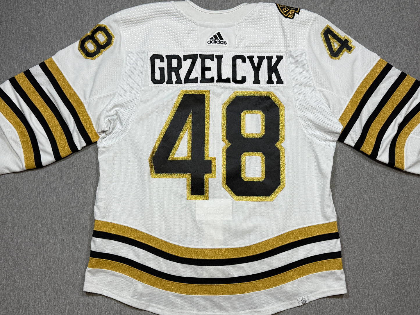Boston Bruins 100th Season Matt Grzelcyk Game Worn Jersey
